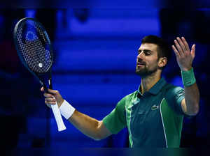 Serbia's Novak Djokovic reacts during his round-robin match against Italy's Jannik Sinner on day 3 of the ATP Finals tennis tournament in Turin on November 14, 2023.