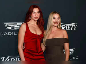 Dua Lipa and Margot Robbie attend the 2023 Variety Power Of Women at Mother Wolf on November 16, 2023 in Los Angeles, California.