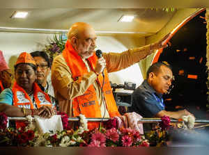 Ajmer: Union Home Minister Amit Shah addresses the gathering during a road show ...