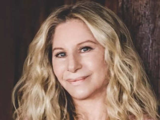Barbra Streisand reflects on her life in a candid memoir, sharing stories of love, slights, and unique encounters with famous figures.