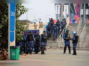 Security personnel gather outside the Narendra Modi Stadium in Ahmedabad on November 18, 2023, on the eve of the 2023 ICC Men's Cricket World Cup one-day international (ODI) final match between India and Australia.
