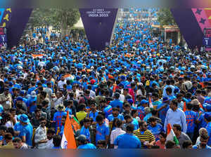 Spectators enter the stadium to watch the 2023 ICC Men's Cricket World Cup one-day international (ODI) final match between India and Australia at the Narendra Modi Stadium in Ahmedabad on November 19, 2023.