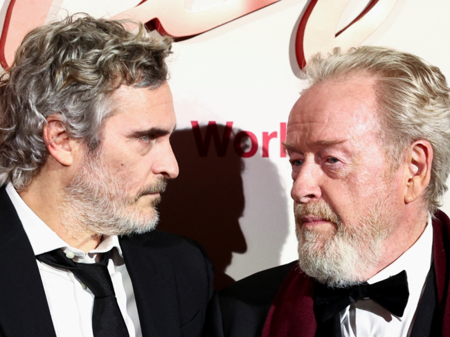 Director Ridley Scott and cast member Joaquin Phoenix look on during a photocall for the World Premiere of the film 'Napoleon' at the Salle Pleyel in Paris, France.