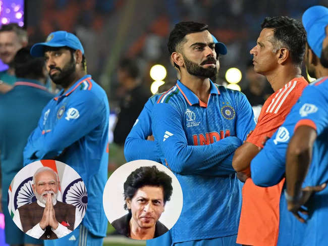 India's coach Rahul Dravid (in orange) stands along with his team players at the end of the 2023 ICC Men's Cricket World Cup one-day international (ODI) final match between India and Australia at the Narendra Modi Stadium in Ahmedabad.