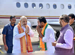 Hyderabad: Union Home Minister Amit Shah being received by Union Minister and Te...