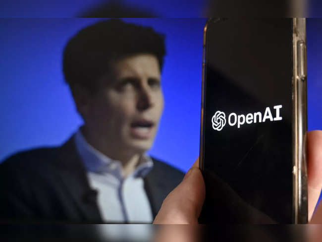 This illustration photo produced in Arlington, Virginia on November 20, 2023, shows a smart phone screen displaying the logo of OpenAI juxtaposed with a screen showing a photo of former OpenAI CEO Sam Altman attending the Asia-Pacific Economic Cooperation (APEC) Leaders' Week in San Francisco, California, on November 16, 2023.