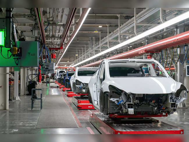Cars are seen on the assembly line during a tour of the Tesla Giga Texas manufacturing facility ahead of the "Cyber Rodeo" grand opening party on April 7, 2022 in Austin, Texas.