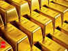 Gold up on weaker dollar as investors wager on Fed rate path