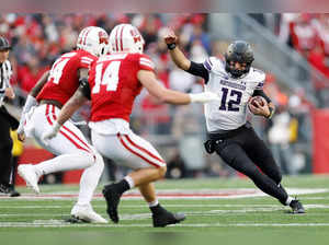 Jack Lausch #12 of the Northwestern Wildcats runs with the football in the second quarter against the Wisconsin Badgers at Camp Randall Stadium on November 11, 2023 in Madison, Wisconsin.