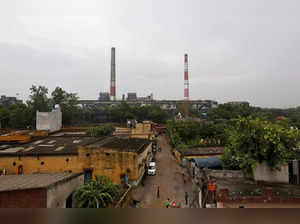 FILE PHOTO: Chimneys of a coal-fired power plant are pictured in New Delhi