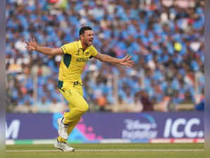 Ahmedabad: Australia's Josh Hazlewood celebrates the wicket of India's Ravindra ...