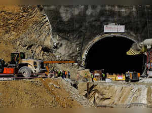 Heavy machinery moves outside a tunnel where 40 road workers are trapped after a portion of the tunnel collapsed in Uttarkashi