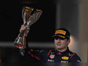 Red Bull driver Max Verstappen of the Netherlands celebrates after winning the A...