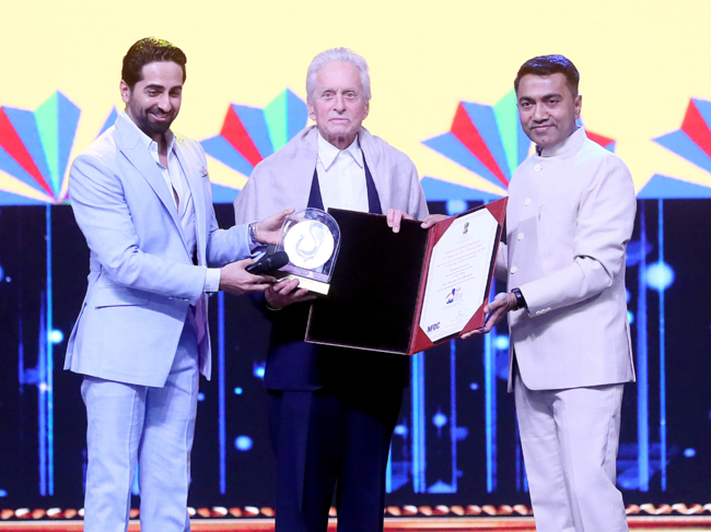 CM Pramod Sawant along with Bollywood actor Ayushmann Khurrana presented the prestigious Satyajit Ray Lifetime Achievement Award 2023 to the legendary Hollywood star Michael Douglas.​