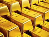 Gold eases as dollar ticks up, Fed rate cut bets lend support