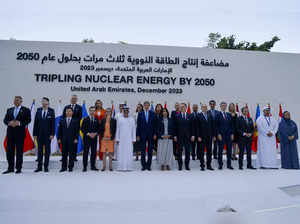 Participants pose for a photo during the Tripling Nuclear Energy by 2050 session at the United Nations climate summit in Dubai on December 2, 2023.