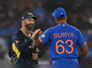 Australia's captain Matthew Wade (L) gestures to his Indian counterpart Suryakumar Yadav after the toss before the start of the fourth Twenty20 international cricket match between India and Australia at the Shaheed Veer Narayan Singh International Cricket Stadium in Raipur on December 1, 2023.