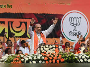 India's Home Minister Amit Shah addresses a gathering during a public meeting organised by the Bharatiya Janata Party (BJP) in Kolkata on November 29, 2023.