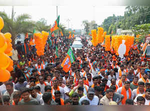 Jagtial, Nov 27 (ANI): Bharatiya Janata Party (BJP) supporters during a roadshow...