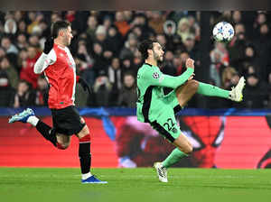 Atletico Madrid's Spanish defender #22 Mario Hermoso kicks the ball and scores his team's second goal during the UEFA Champions League Group E football match between Feyenoord and Atletico Madrid at the De Kuip Stadium in Rotterdam on November 28, 2023.