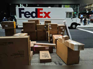 Parcels are seen in a street nearby a FedEx truck in a street of the Manhattan borough in New York City on December 4, 2023.
