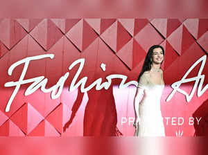 US actress Anne Hathaway poses on the red carpet upon arrival at The 2023 Fashion Awards at the Royal Albert Hall, in London, on December 4, 2023.
