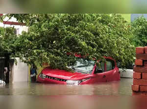 Chennai, Dec 04 (ANI): A car partially submerged in the waterlogged road followi...