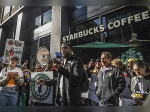 Thousands of Starbucks workers go on a one-day strike on one of the chain's busiest days of year