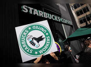 Members of the Starbucks Workers Union picket and hold a rally outside Starbucks store in New York