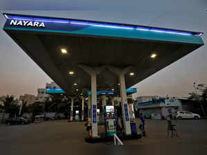 A worker stands at a fuel station of Nayara Energy on the outskirts of Ahmedabad