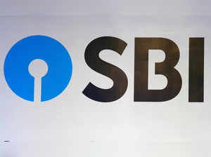 FILE PHOTO: The new logo of State Bank of India (SBI) is pictured at the podium of the venue of a news conference after the announcement of SBI's fourth quarter results, in Kolkata