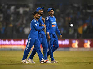 India's Rinku Singh, Axar Patel and Shreyas Iyer walk back to the pavilion after their win in the fourth Twenty20 international cricket match between India and Australia at the Shaheed Veer Narayan Singh International Cricket Stadium in Raipur on December 1, 2023.