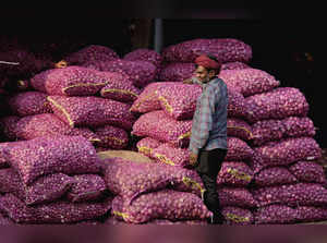 New Delhi: A vendor at Azadpur Mandi as the retail price of onion remains elevat...