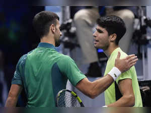 Serbia's Novak Djokovic, left, is congratulated by Spain's Carlos Alcaraz follow...