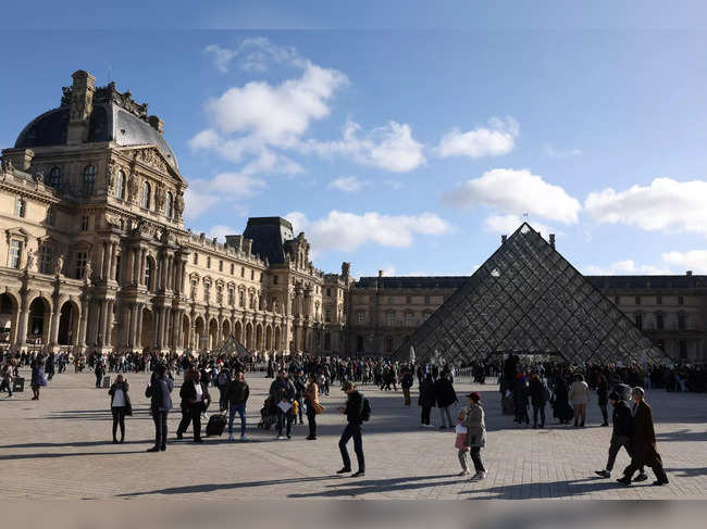 Tourists at the Louvre Museum in Paris