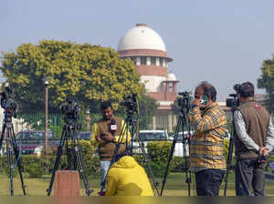 New Delhi: Media persons at the Supreme Court complex on the day of the court's ...