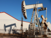 Oil prices hold near six-month lows