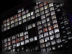 Lights are switched on in an office building in Brussels