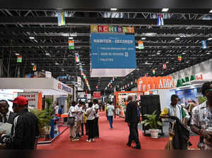 A general view of visitors at exhibition stands during the architecture and building fair at the Abidjan exhibition center on December 13, 2023.