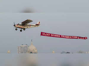 Kolkata: An Indian Army helicopter flies past during the 'Military Tattoo' show ...