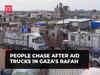 Israel-Hamas war: People chase after aid trucks in Gaza’s Rafah