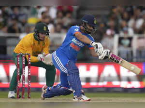India's batsman Rinku Singh, right, plays a shot as South Africa's wicketkeeper ...