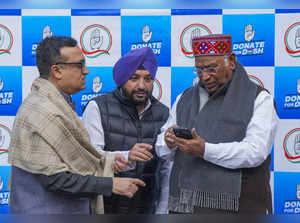 New Delhi: Congress President Mallikarjun Kharge makes a donation during the lau...