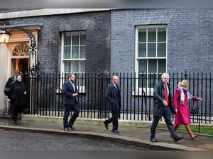 Danny Kruger and Miriam Cates, accompanied by other members of the New Conservatives, walk outside 10 Downing Street in London