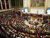 French lawmakers strike deal on tougher immigration bill