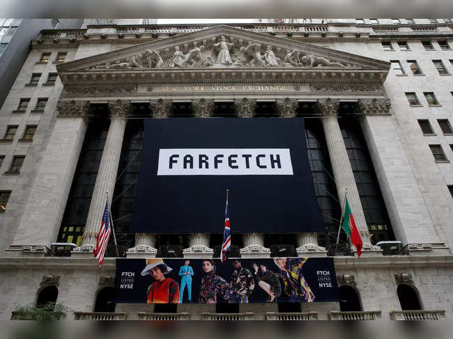 FILE PHOTO: A banner to celebrate the IPO of online fashion house Farfetch is displayed on the facade of the of the NYSE in New York
