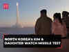 North Korea's Kim and daughter watch long-range missile test