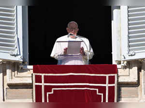 Pope Francis addresses the crowd from the window of the apostolic palace overlooking St. Peter's square during the weekly Angelus prayer on December 17, 2023 in The Vatican.