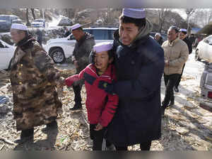 China's earthquake survivors endure frigid temperatures and mourn the dead
