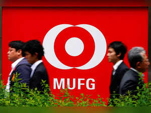FILE PHOTO: People walk past a branch of Mitsubishi UFJ  Financial Group's MUFG Bank in Tokyo